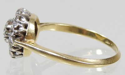 Lot 46 - An 18 carat gold illusion set diamond cluster...