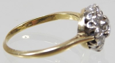 Lot 46 - An 18 carat gold illusion set diamond cluster...