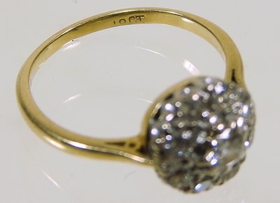 Lot 46 - An 18 carat gold illusion set diamond cluster...