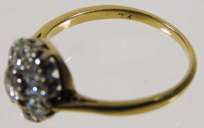 Lot 46 - An 18 carat gold illusion set diamond cluster...
