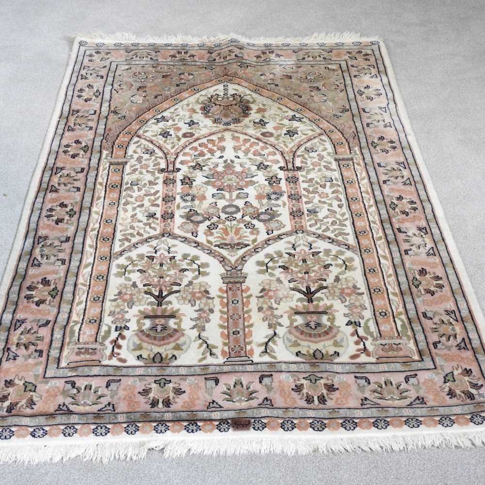 Lot 420 - A Persian woollen prayer rug, with foliate...