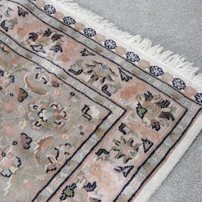 Lot 420 - A Persian woollen prayer rug, with foliate...