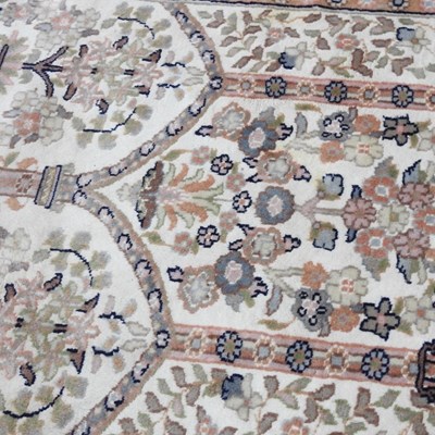 Lot 420 - A Persian woollen prayer rug, with foliate...