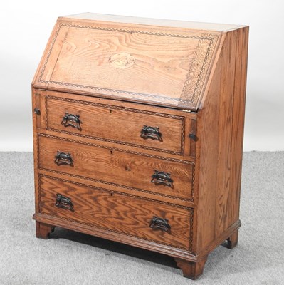 Lot 443 - An early 20th century oak and inlaid bureau