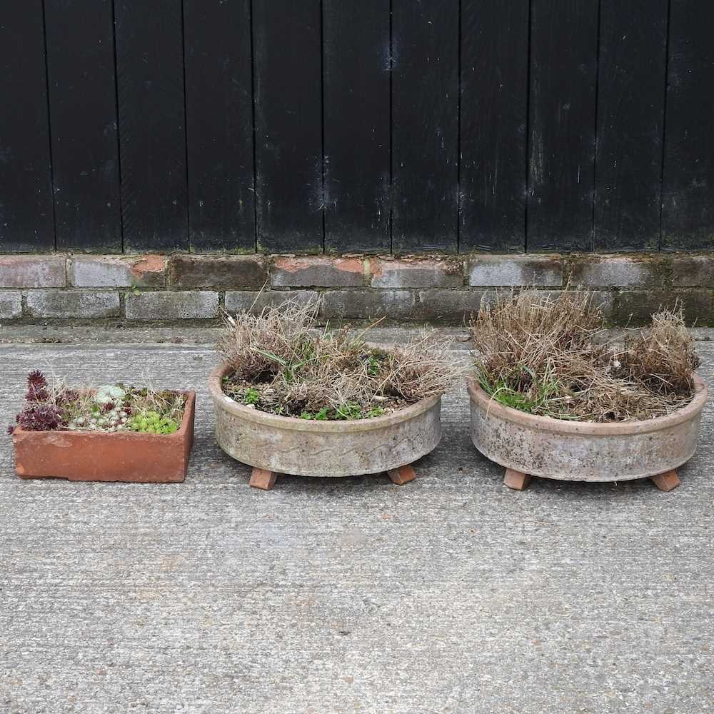 Lot 314 - A pair of circular low terracotta planters