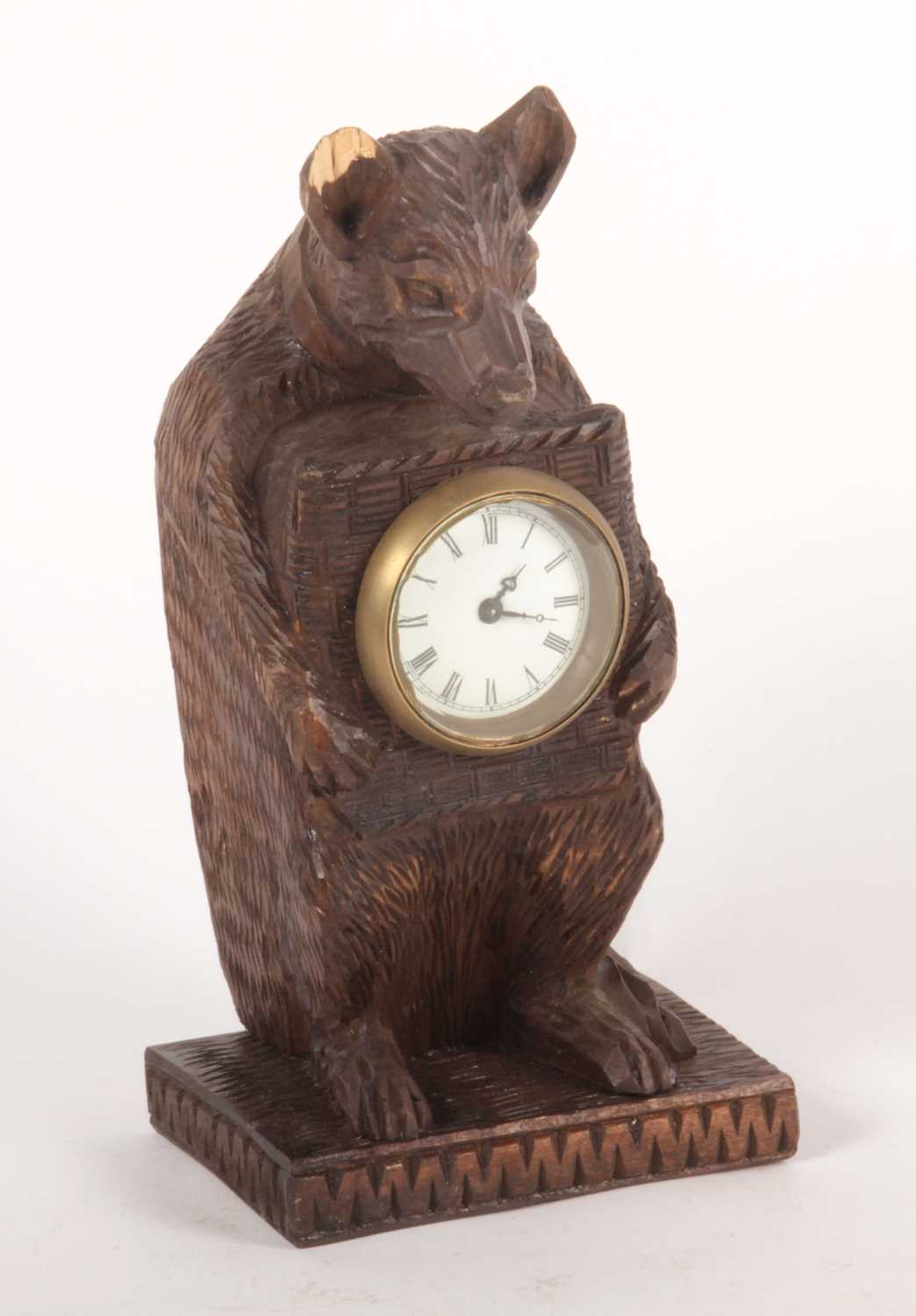 Lot 184 - A Black Forest style carved wood mantel clock,...
