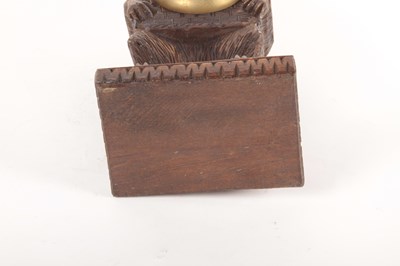 Lot 184 - A Black Forest style carved wood mantel clock,...