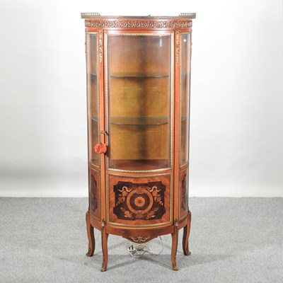 Lot 385 - A 20th century marquetry and gilt metal mounted bow front display cabinet