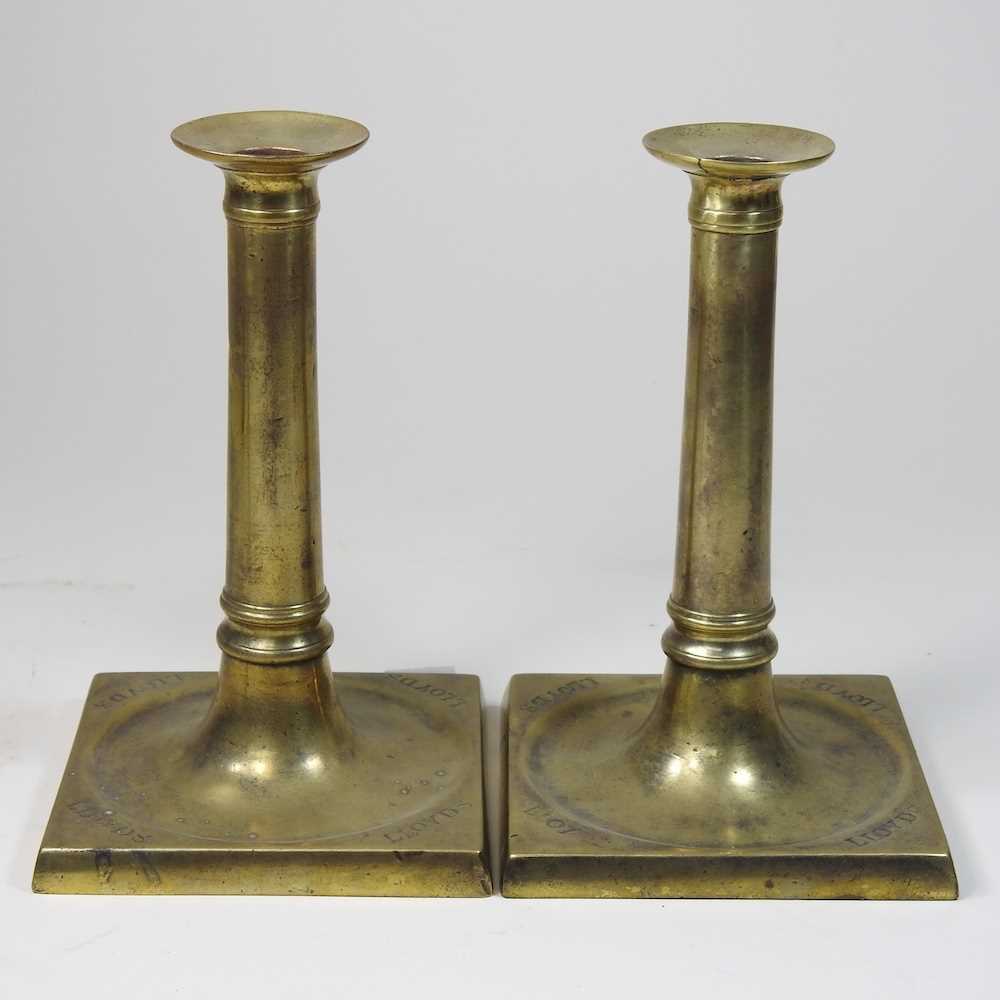 Lot 69 - A pair of George III brass table socket candlesticks