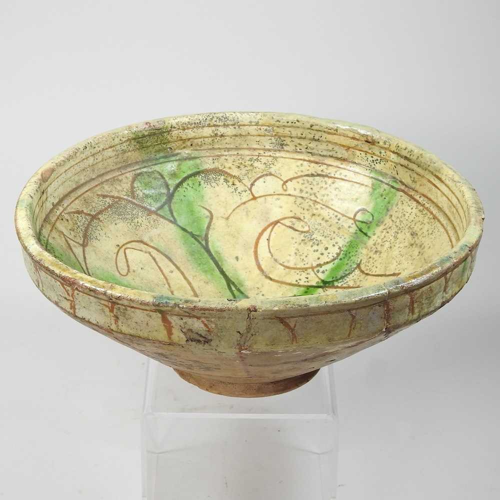 Lot 102 - A Persian glazed pottery bowl