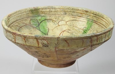 Lot 102 - A Persian glazed pottery bowl