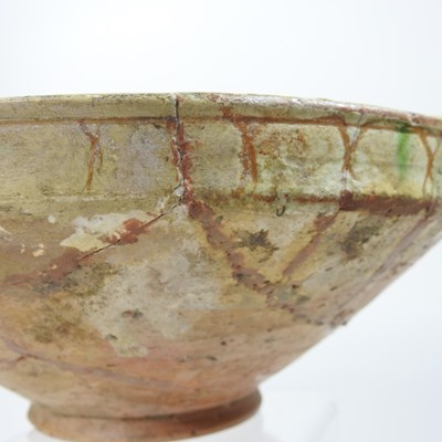 Lot 102 - A Persian glazed pottery bowl