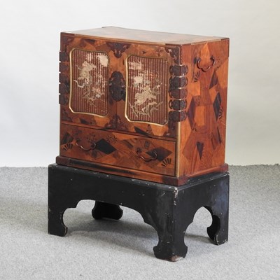 Lot 677 - A 19th century Japanese cabinet on stand
