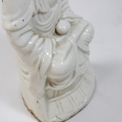 Lot 110 - A Chinese blanc de chine pottery Buddha