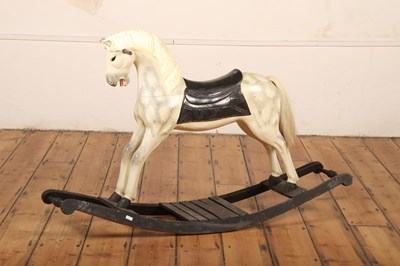 Lot 381 - A carved wooden painted rocking horse