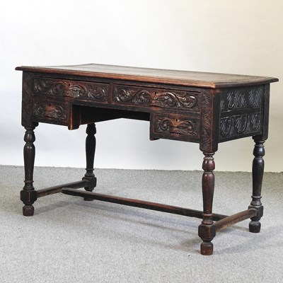Lot 693 - A 19th century carved oak kneehole desk