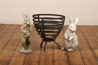 Lot 385 - A reconstituted stone rabbit, together with...