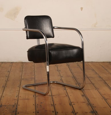 Lot 204 - A mid century chrome and black leather...