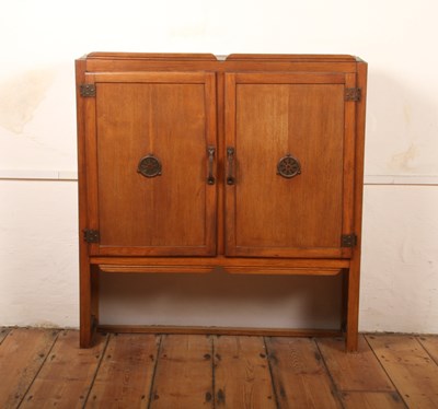 Lot 334 - A wall-mounted oak cupboard