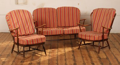 Lot 460 - An Ercol dark elm three piece suite,...