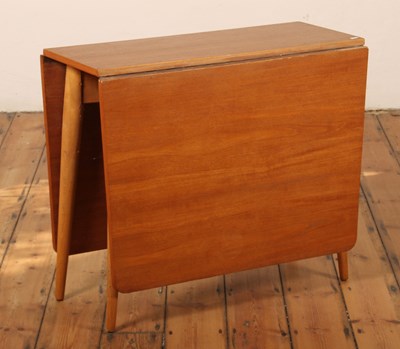 Lot 520 - A 1970s teak drop-leaf dining table