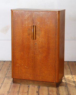 Lot 593 - An Art Deco oak double wardrobe, with a fitted...