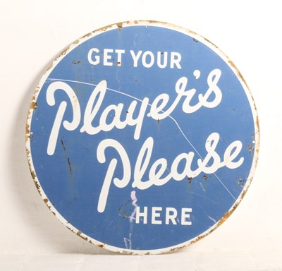 Lot 468 - A circular metal sign inscribed Get Your...