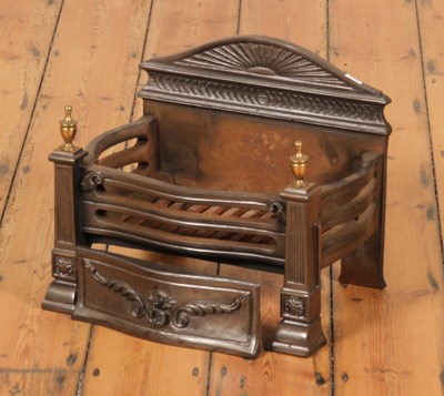 Lot 313 - An iron fire basket, with brass finials