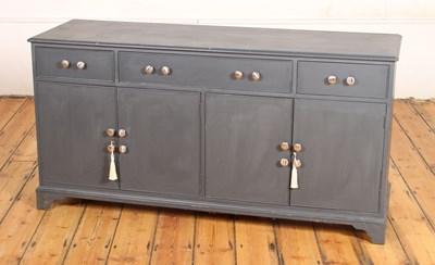 Lot 623 - A grey painted sideboard having three drawers...