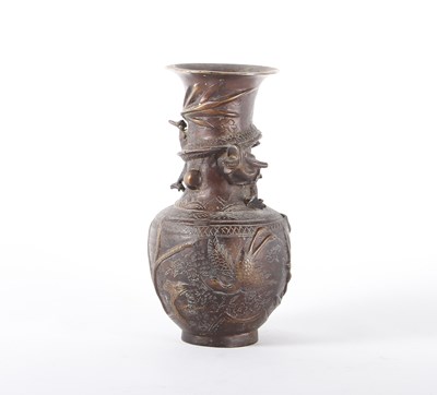 Lot 569 - A Chinese bronze vase, relief decorated with a...