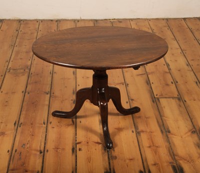 Lot 559 - A 19th century oak tripod occasional table