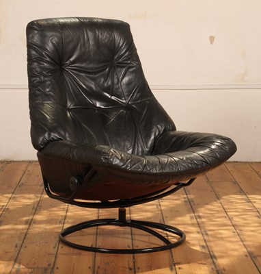 Lot 476 - A Norwegian Ekornes black leather swivel...