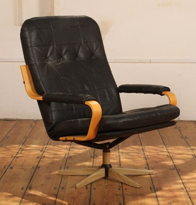 Lot 539 - A Danish black leather button upholstered...