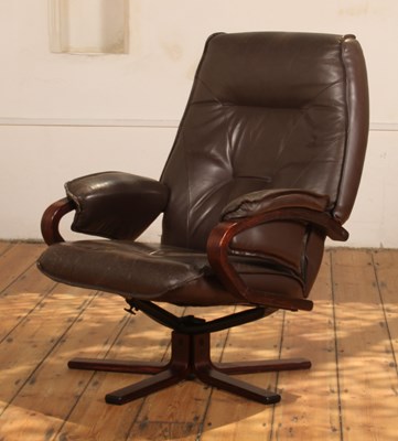 Lot 513 - A Danish brown leather upholstered swivel...