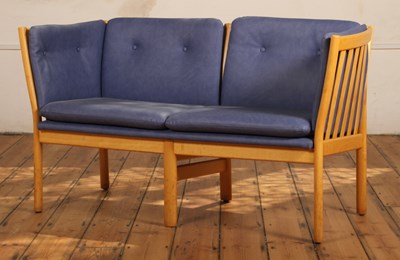 Lot 594 - A Danish blue vinyl upholstered beech two...