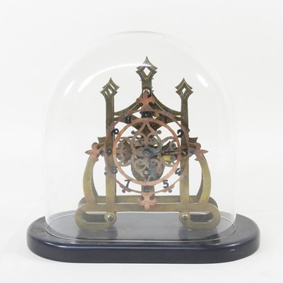 Lot 367 - A brass skeleton clock, contained under a...