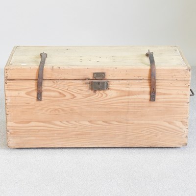 Lot 109 - An antique pine chest with hinged lid, flanked...