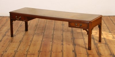 Lot 480 - A mahogany coffee table, having a green...