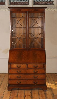 Lot 595 - A George III style mahogany bureau bookcase