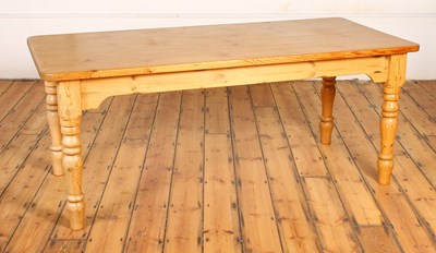 Lot 520 - A pine kitchen/dining table, on turned legs