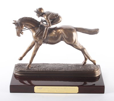 Lot 518 - A bronzed model of a horse and rider, bearing...