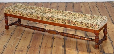 Lot 341 - An Edwardian walnut long floral upholstered stool