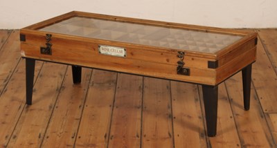 Lot 608 - A glazed pine coffee table, the top lifting to...
