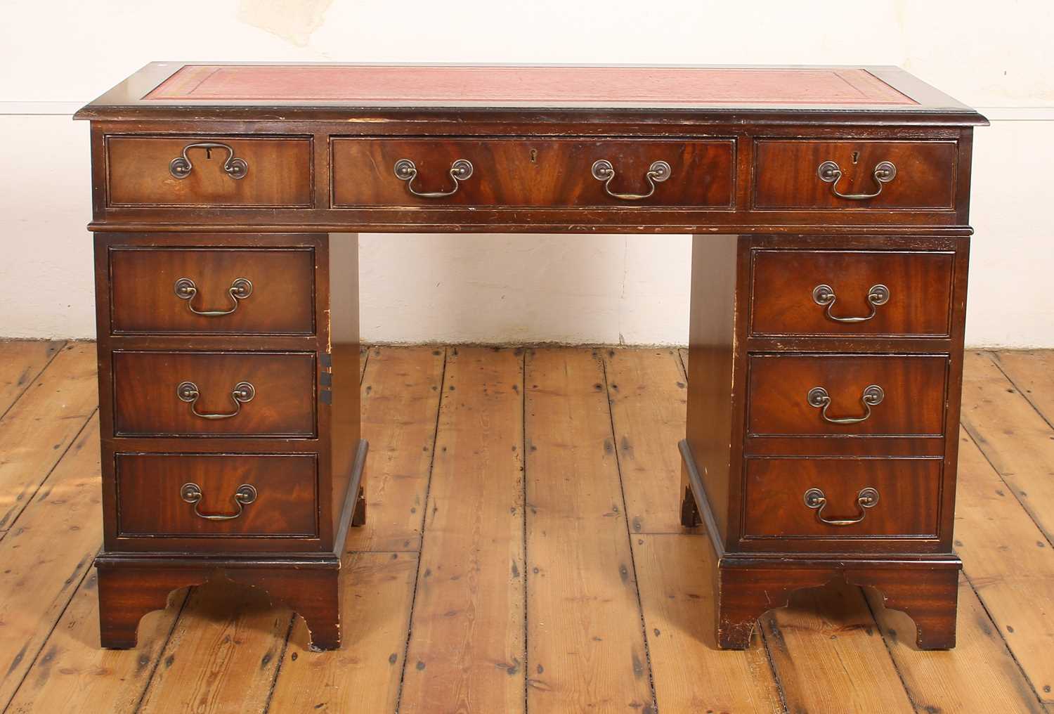 Lot 603 - A reproduction mahogany pedestal desk, having...