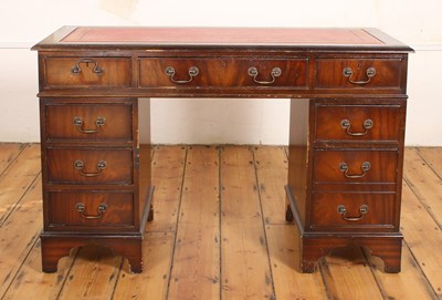 Lot 603 - A reproduction mahogany pedestal desk, having...