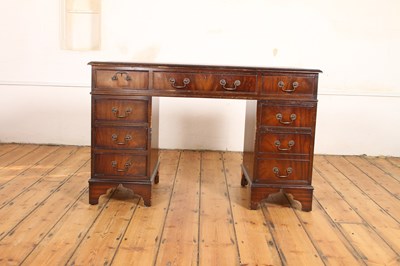 Lot 603 - A reproduction mahogany pedestal desk, having...