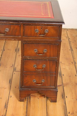 Lot 603 - A reproduction mahogany pedestal desk, having...