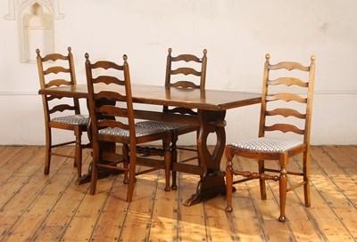 Lot 435 - An oak trestle dining table, having heart...