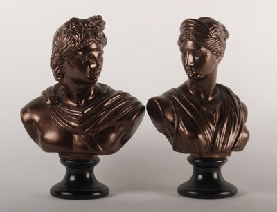 Lot 356 - A pair of painted plaster busts of Apollo and...