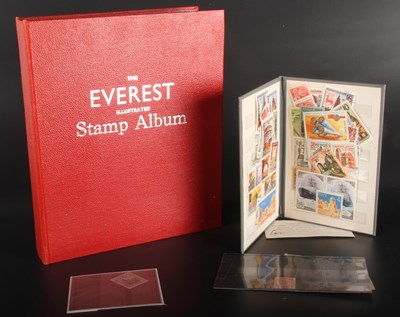 Lot 174 - An Everest Illustrated Stamp Album, housing a...